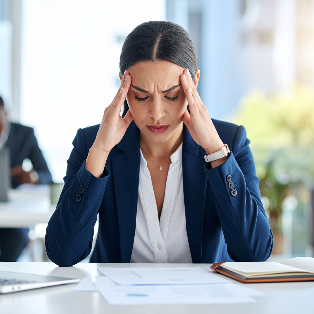 Distressed business woman at desk